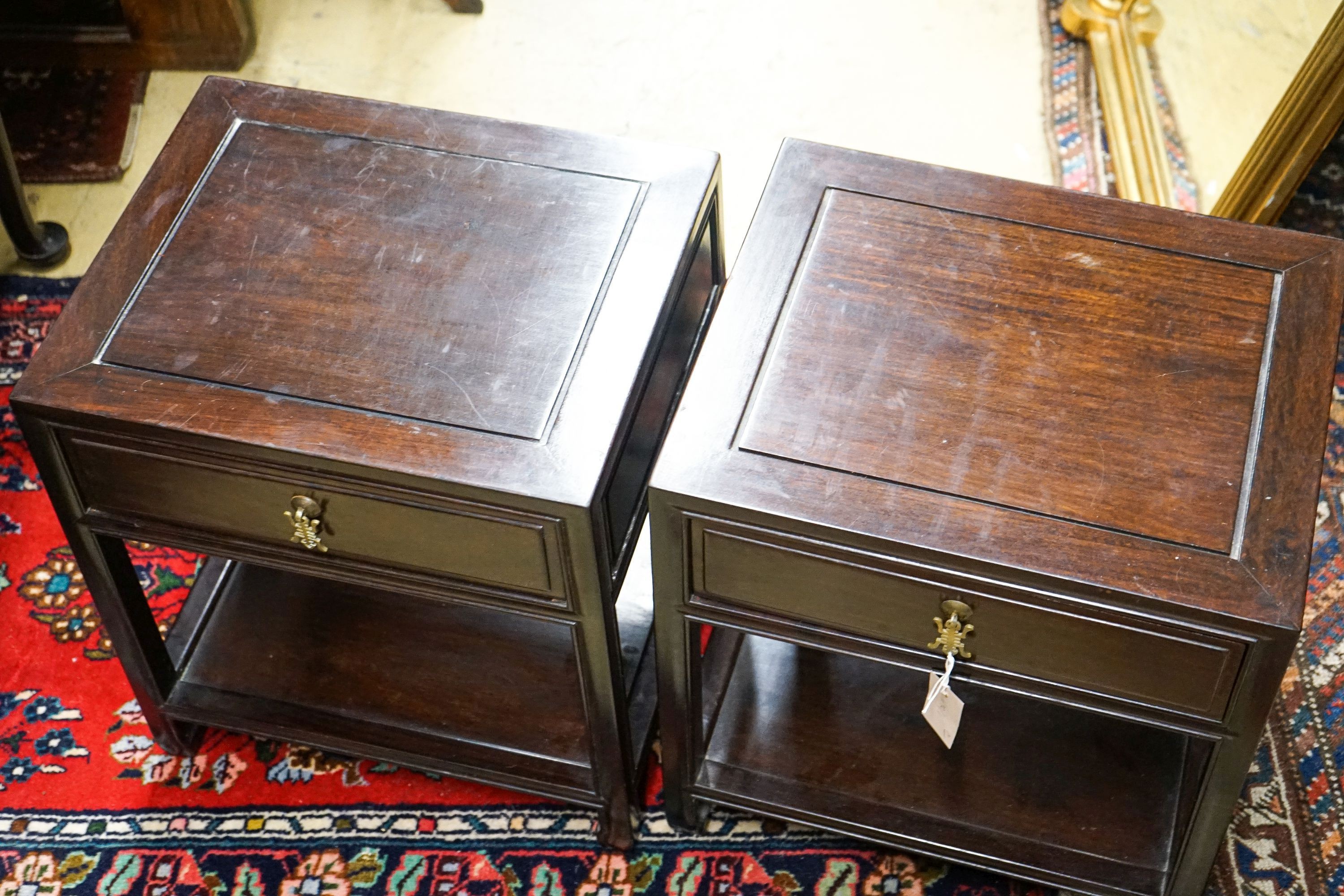 A pair of Chinese hardwood bedside tables, width 46cm, depth 38cm, height 51cm